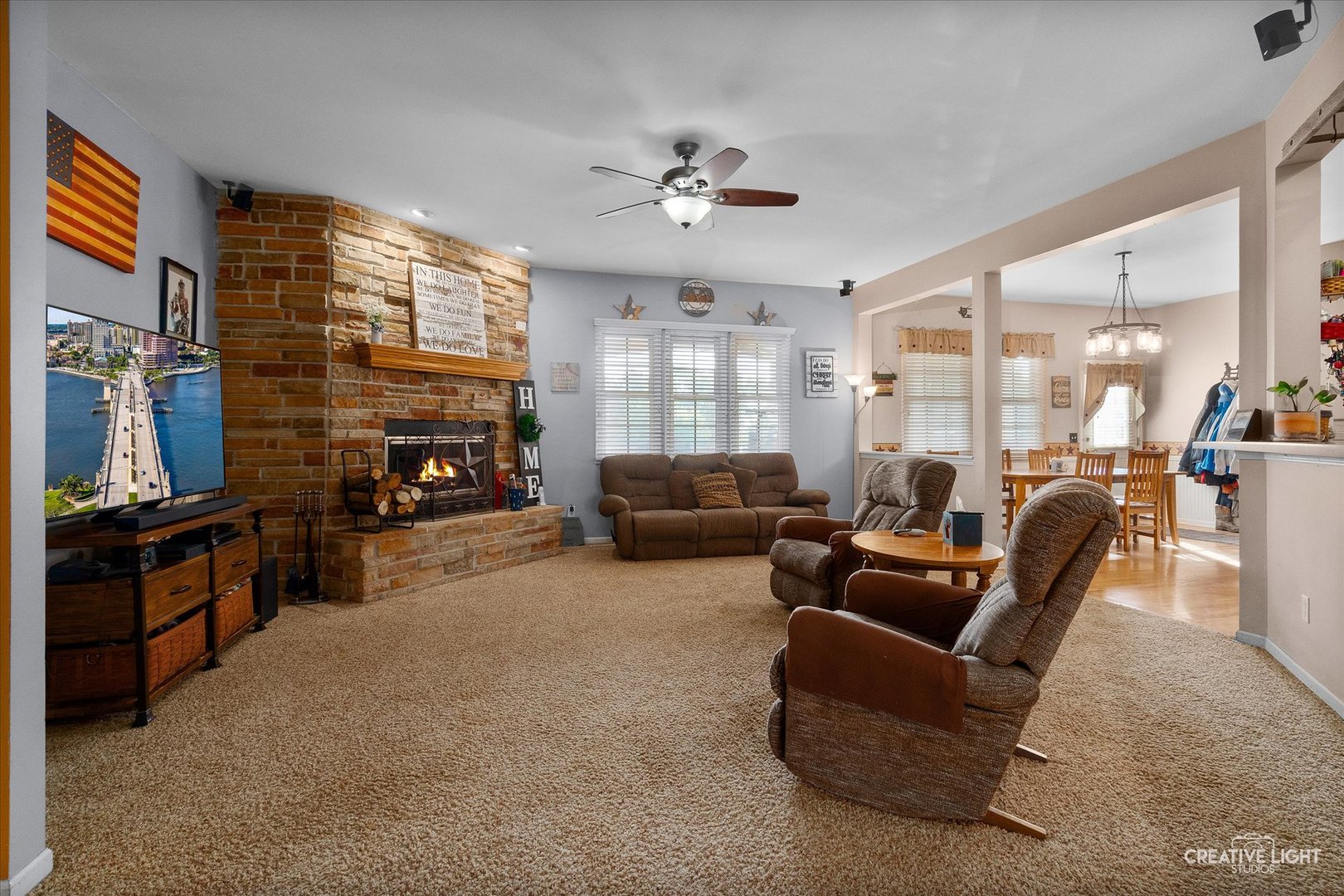 1750 Little Rock Road Plano, IL 60545 - Photo 16 of 33 a living room with furniture and a fireplace