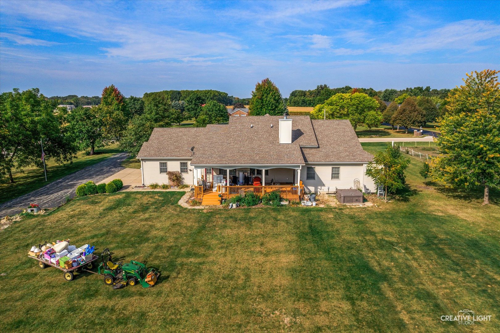1750 Little Rock Road Plano, IL 60545 - Photo 32 of 33 a view of a house with a big yard potted plants and large tree