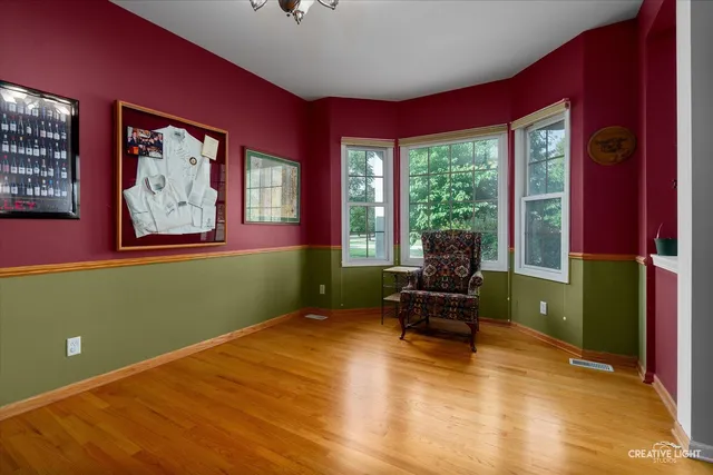 a living room with furniture and large windows