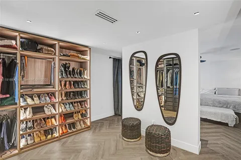 a spacious bathroom with a tub double vanity and a mirror