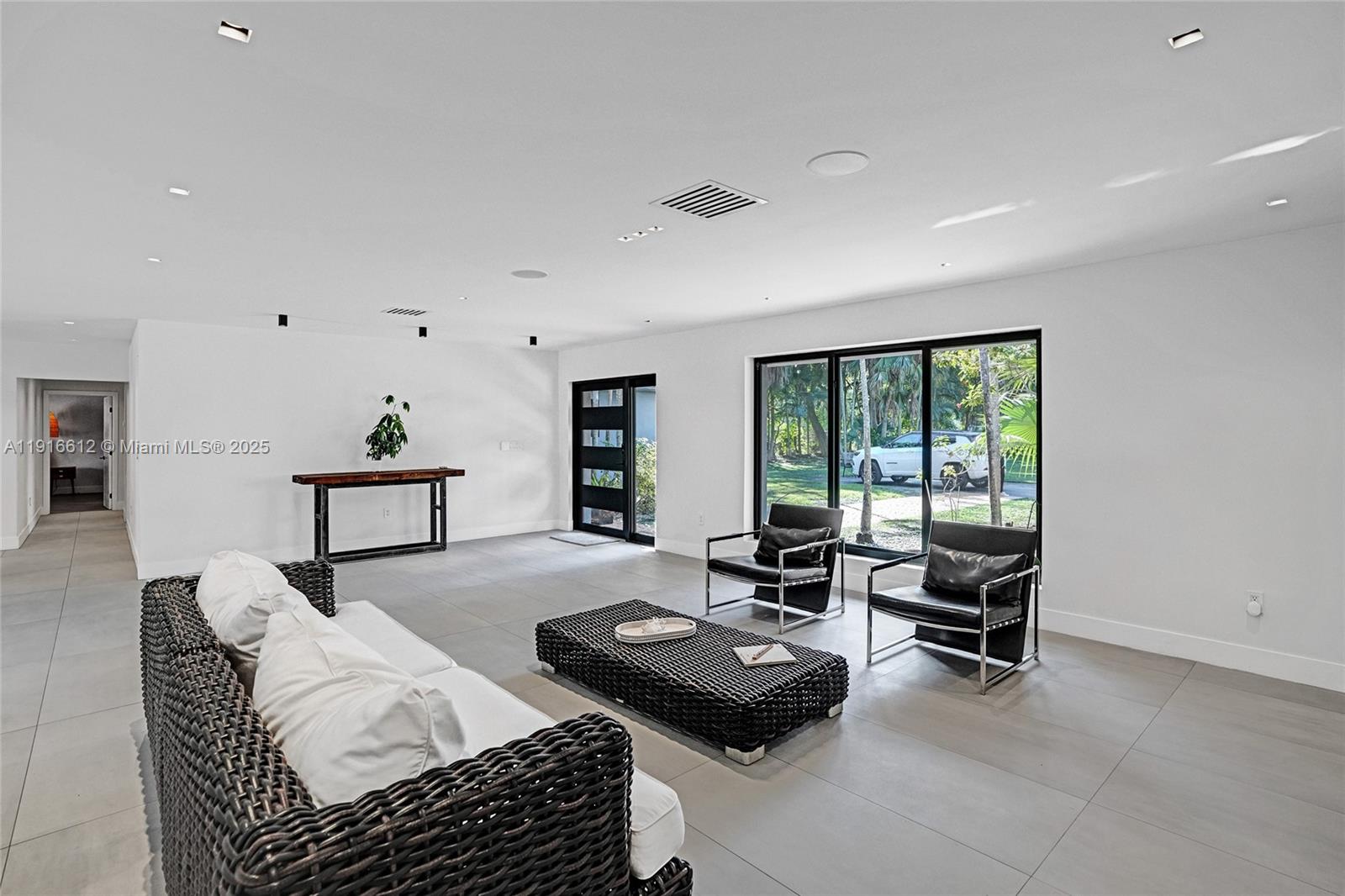 14135 North Miami Avenue Miami, FL 33168 - Photo 18 of 32 a bedroom with furniture and a window