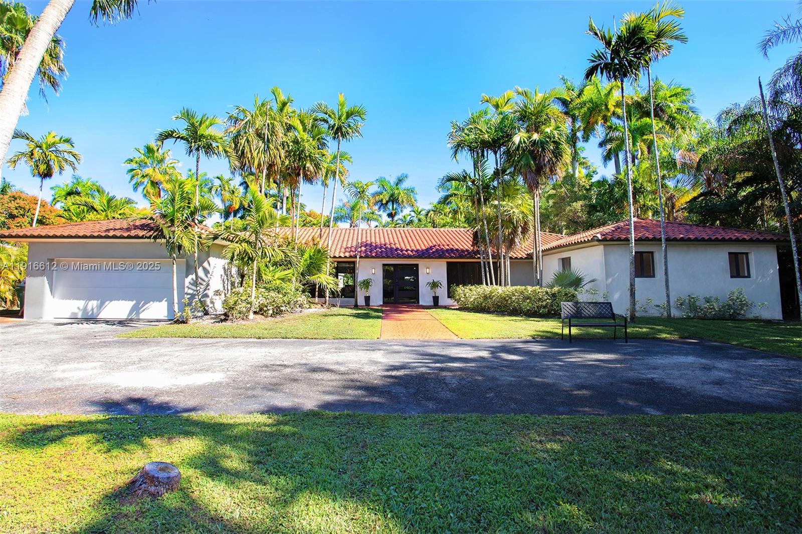 14135 North Miami Avenue Miami, FL 33168 - Photo 2 of 32 a view of a house with a yard and sitting area