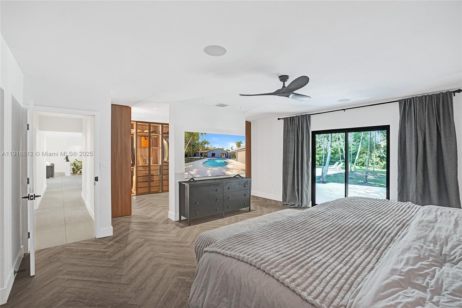 14135 North Miami Avenue Miami, FL 33168 - Photo 21 of 32 a bedroom with a bed and a large window