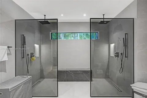 a view of a livingroom with workspace and a window