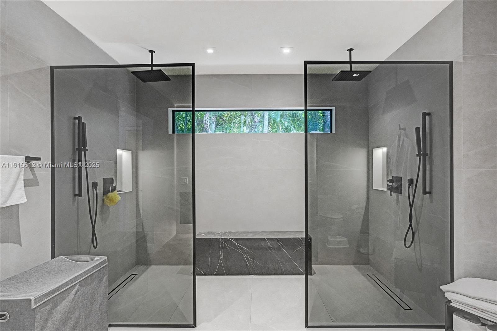 14135 North Miami Avenue Miami, FL 33168 - Photo 22 of 32 a bathroom with a shower and a glass door shower