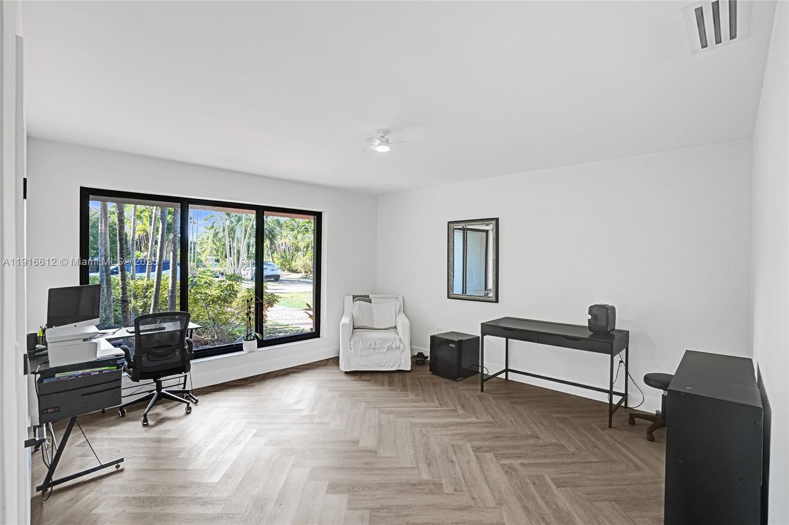14135 North Miami Avenue Miami, FL 33168 - Photo 24 of 32 a living room with furniture and floor to ceiling window