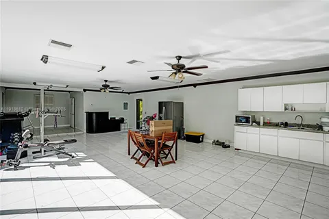 a bathroom with a sink mirror and toilet