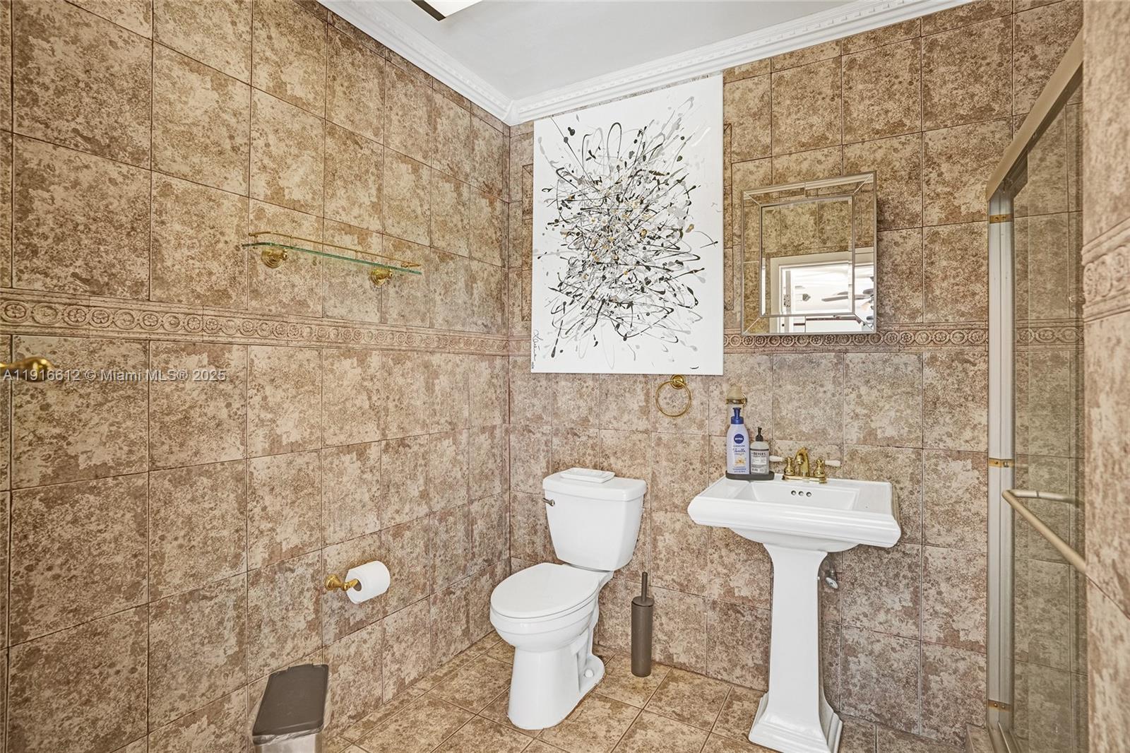 14135 North Miami Avenue Miami, FL 33168 - Photo 31 of 32 a bathroom with a sink mirror and toilet