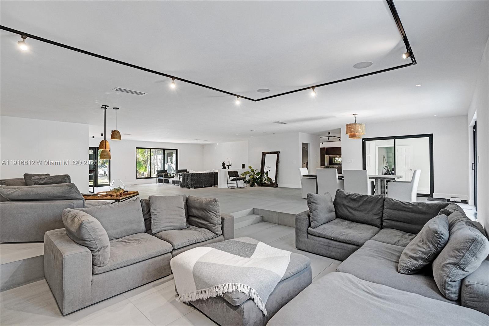 14135 North Miami Avenue Miami, FL 33168 - Photo 4 of 32 a living room with furniture and a ceiling fan
