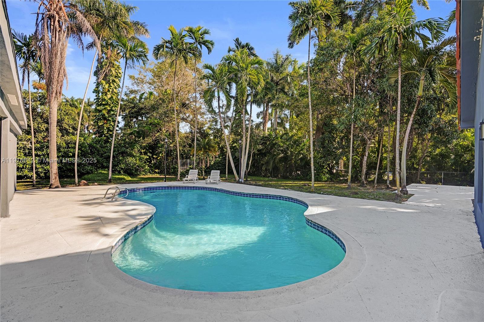 14135 North Miami Avenue Miami, FL 33168 - Photo 8 of 32 a view of a swimming pool with a patio
