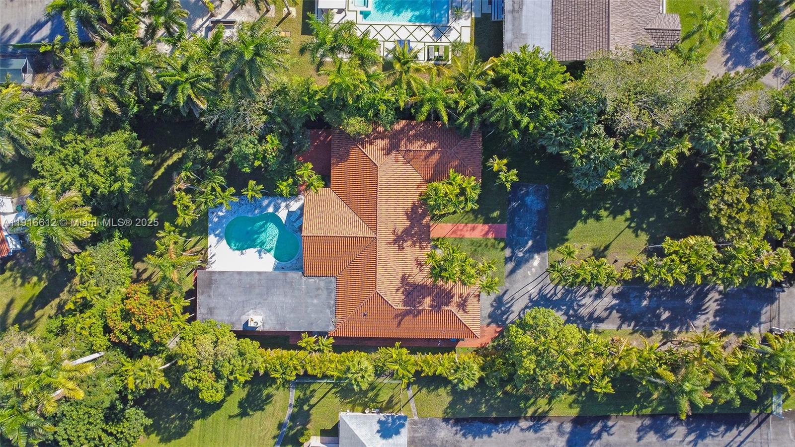14135 North Miami Avenue Miami, FL 33168 - Photo 9 of 32 an aerial view of a house with a yard