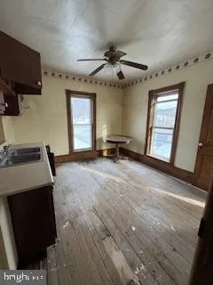 a view of a livingroom with furniture and a flat screen tv