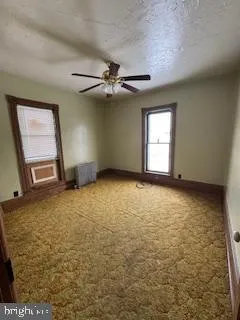 en empty room with windows