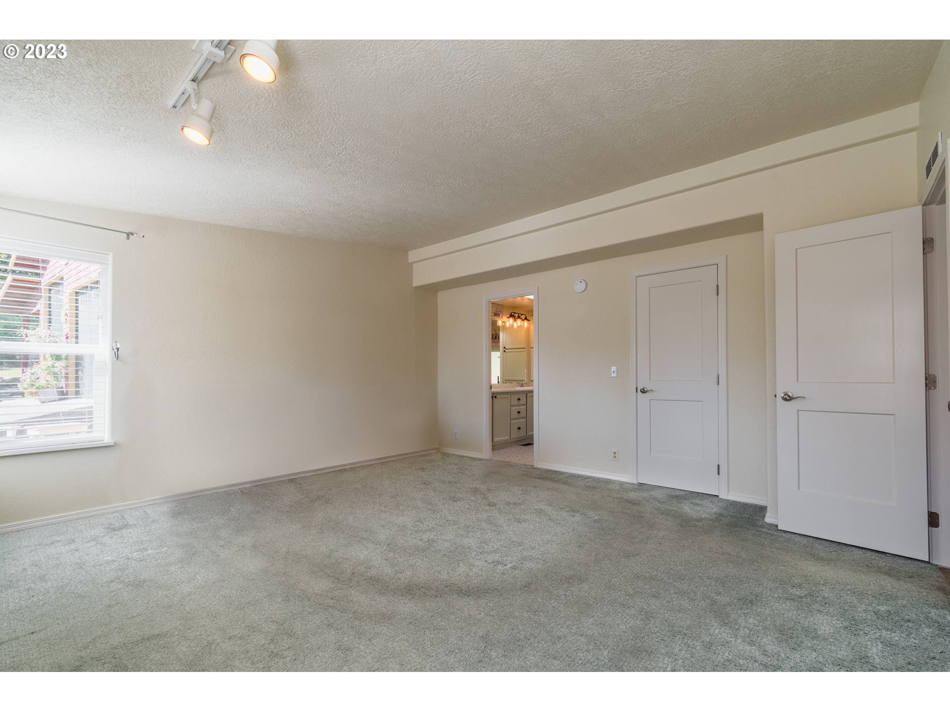 28485 Briggs Hill Road Eugene, OR 97405 - Photo 14 of 36 a view of an empty room and window