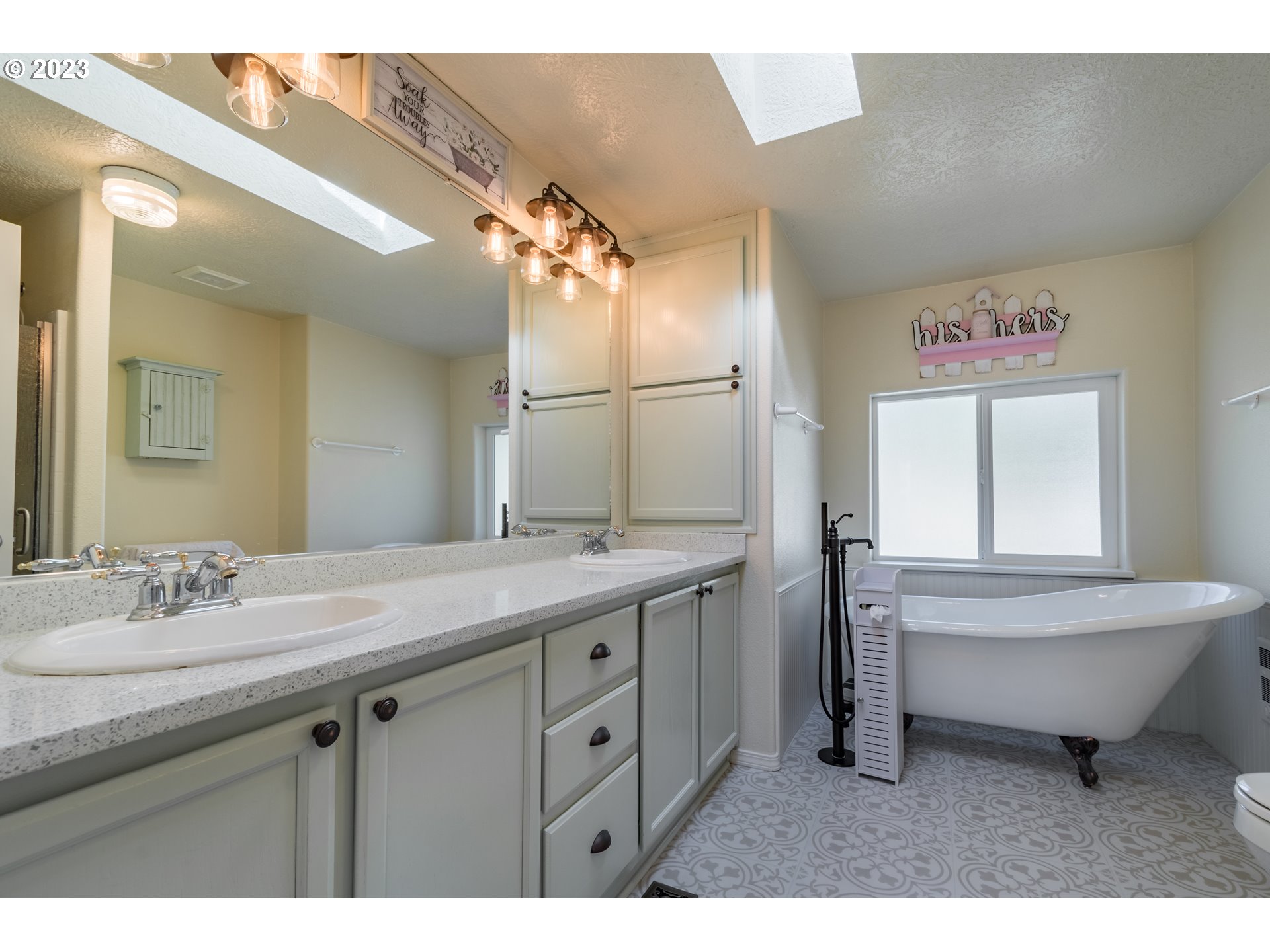 28485 Briggs Hill Road Eugene, OR 97405 - Photo 15 of 36 a bathroom with a sink a toilet a mirror and shower