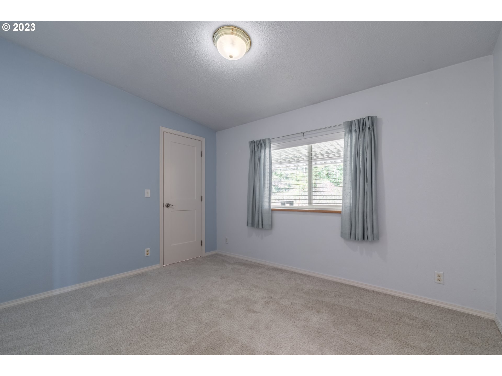 28485 Briggs Hill Road Eugene, OR 97405 - Photo 19 of 36 a view of an empty room with a window