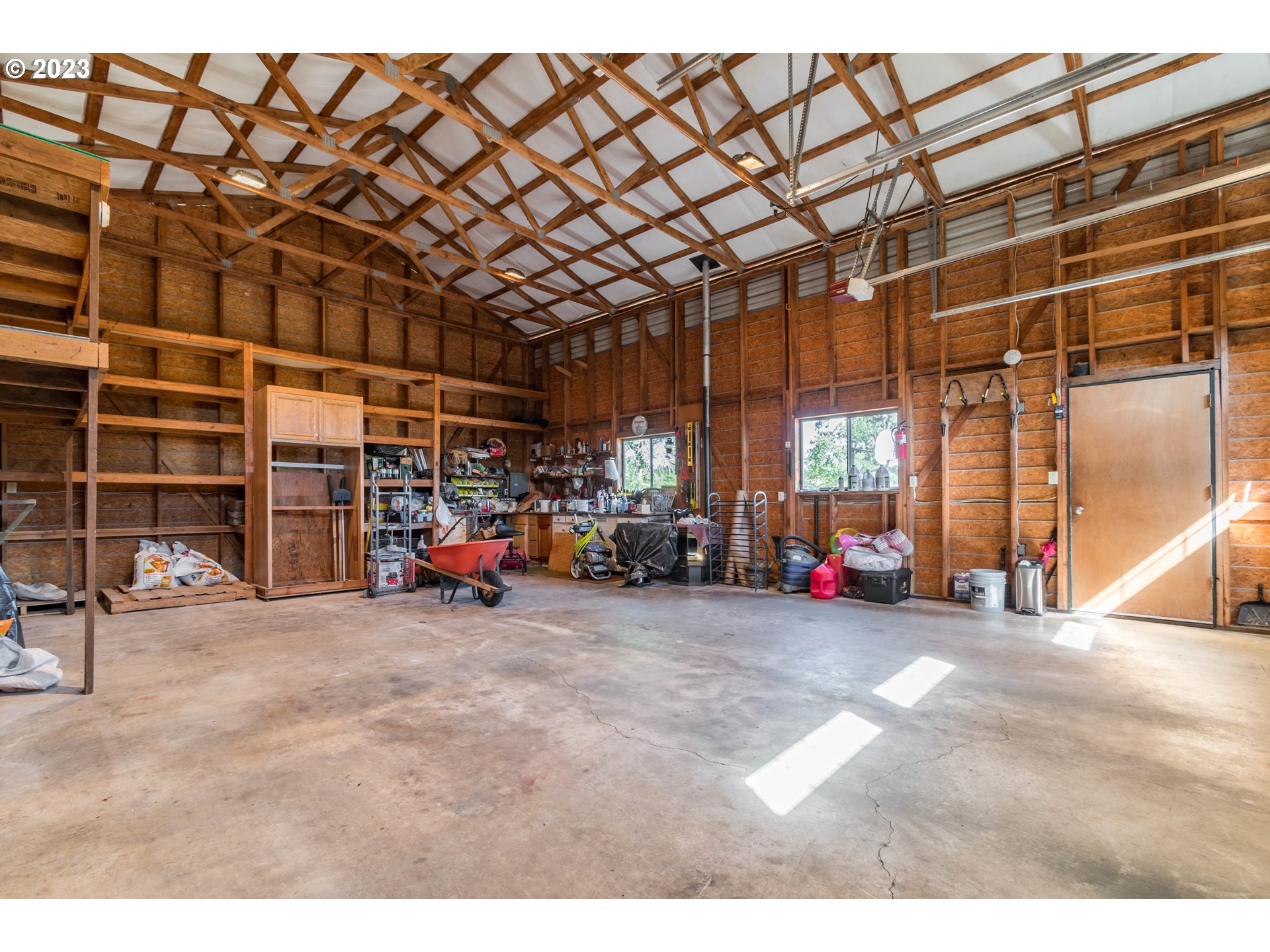 28485 Briggs Hill Road Eugene, OR 97405 - Photo 26 of 36 a view of a big room with air conditioner duct and materials on floor