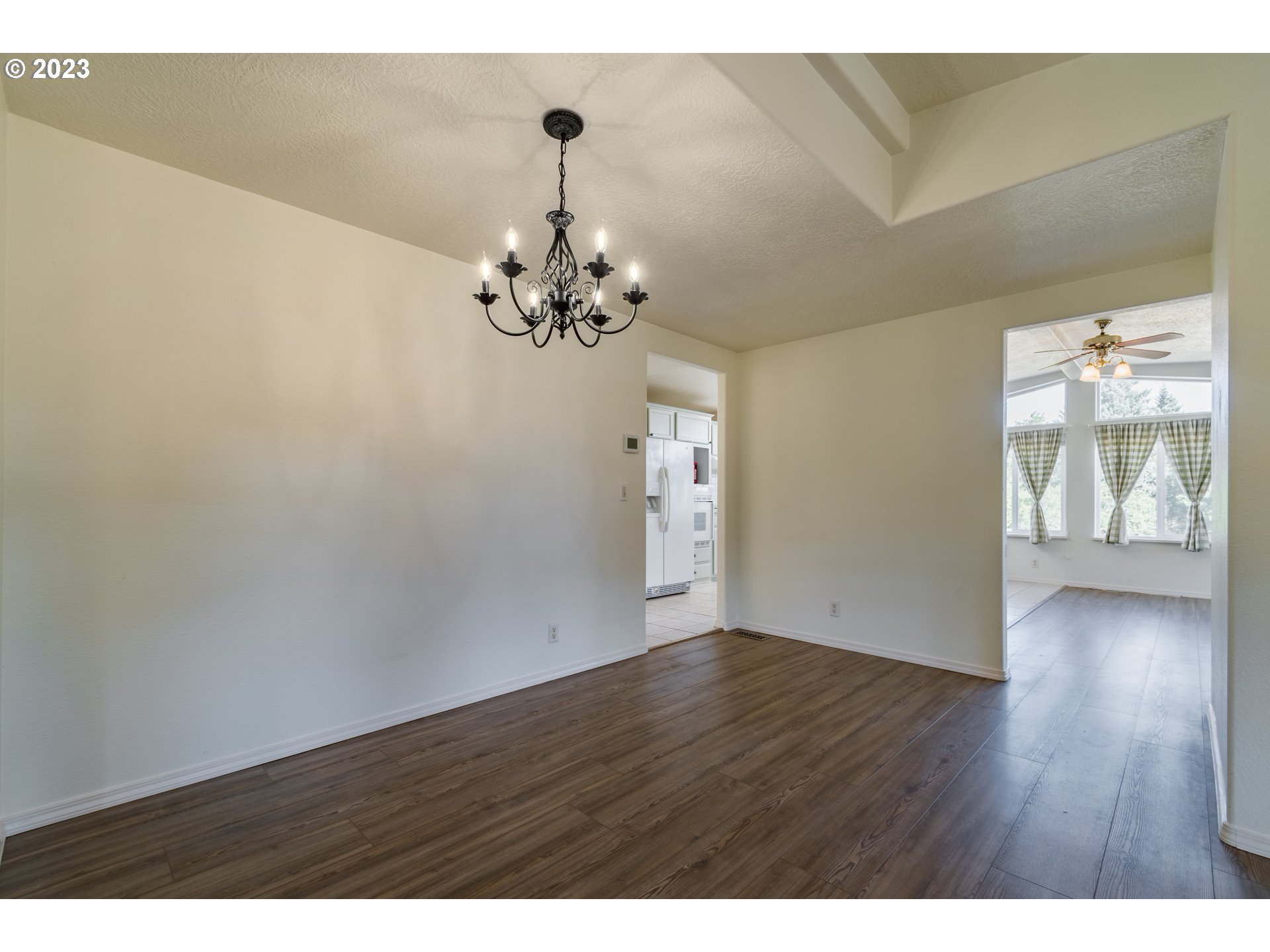 28485 Briggs Hill Road Eugene, OR 97405 - Photo 3 of 36 a view of an empty room with wooden floor