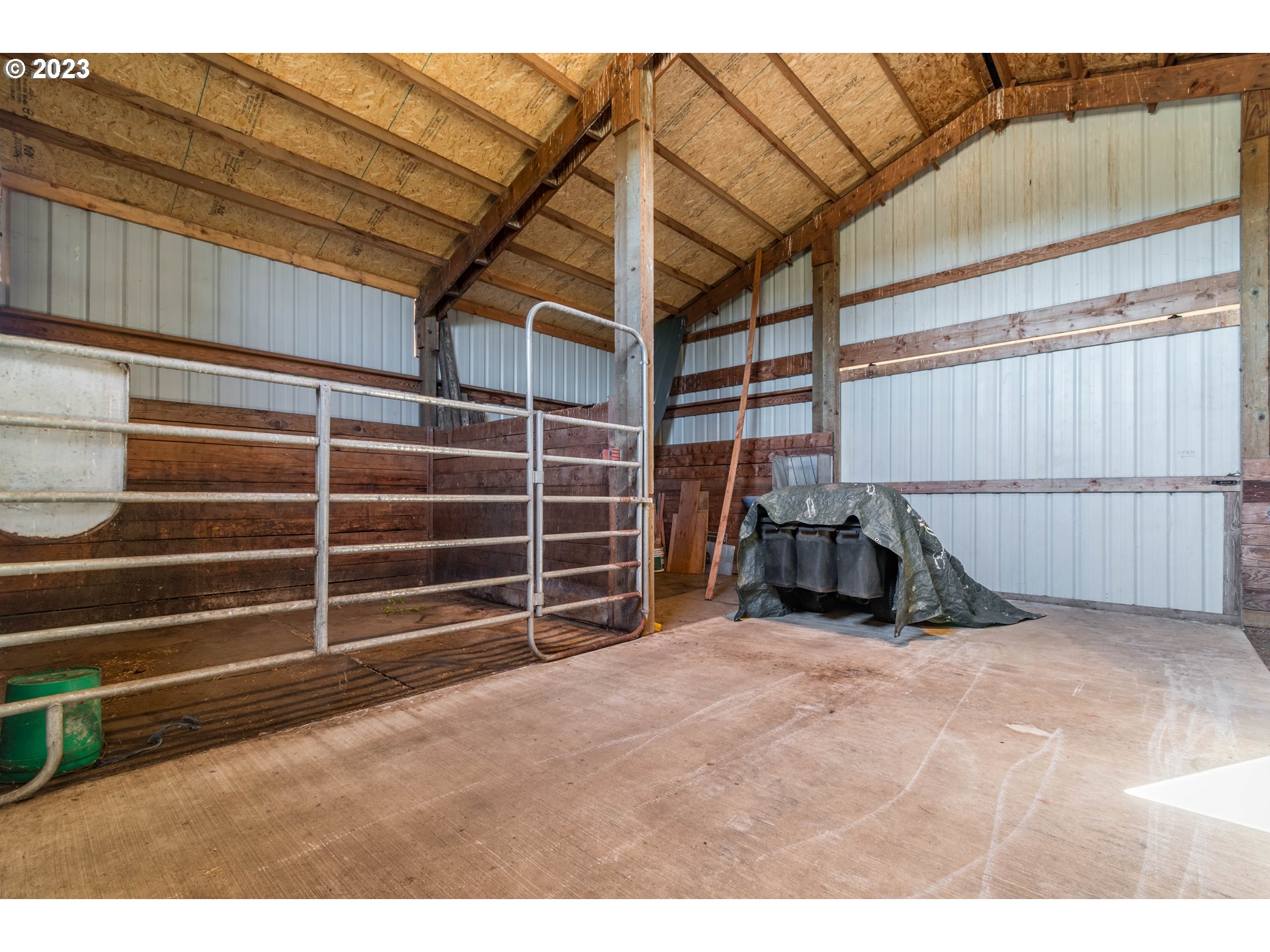 28485 Briggs Hill Road Eugene, OR 97405 - Photo 31 of 36 a view of an empty room with wooden walls