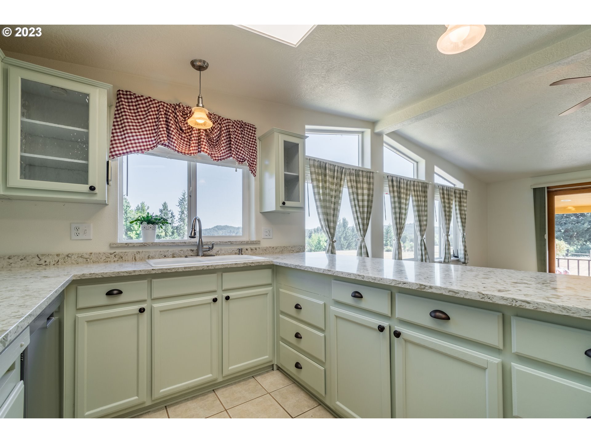 28485 Briggs Hill Road Eugene, OR 97405 - Photo 10 of 36 a kitchen with cabinets and window