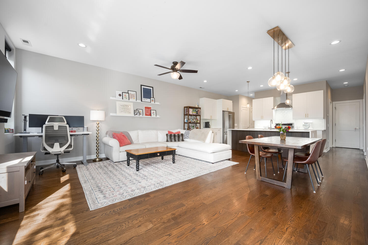 1841 North California Avenue, Unit 3B Chicago, IL 60647 - Photo 11 of 22 a living room with furniture a table and wooden floor