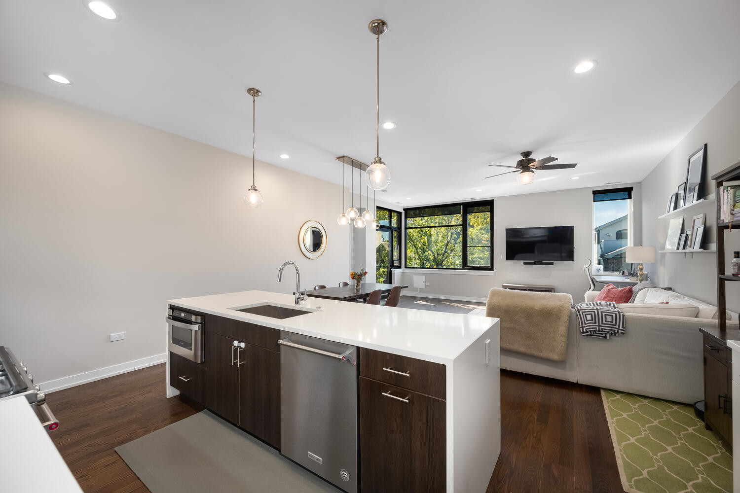 1841 North California Avenue, Unit 3B Chicago, IL 60647 - Photo 7 of 22 a view of living room kitchen with a sink and couch