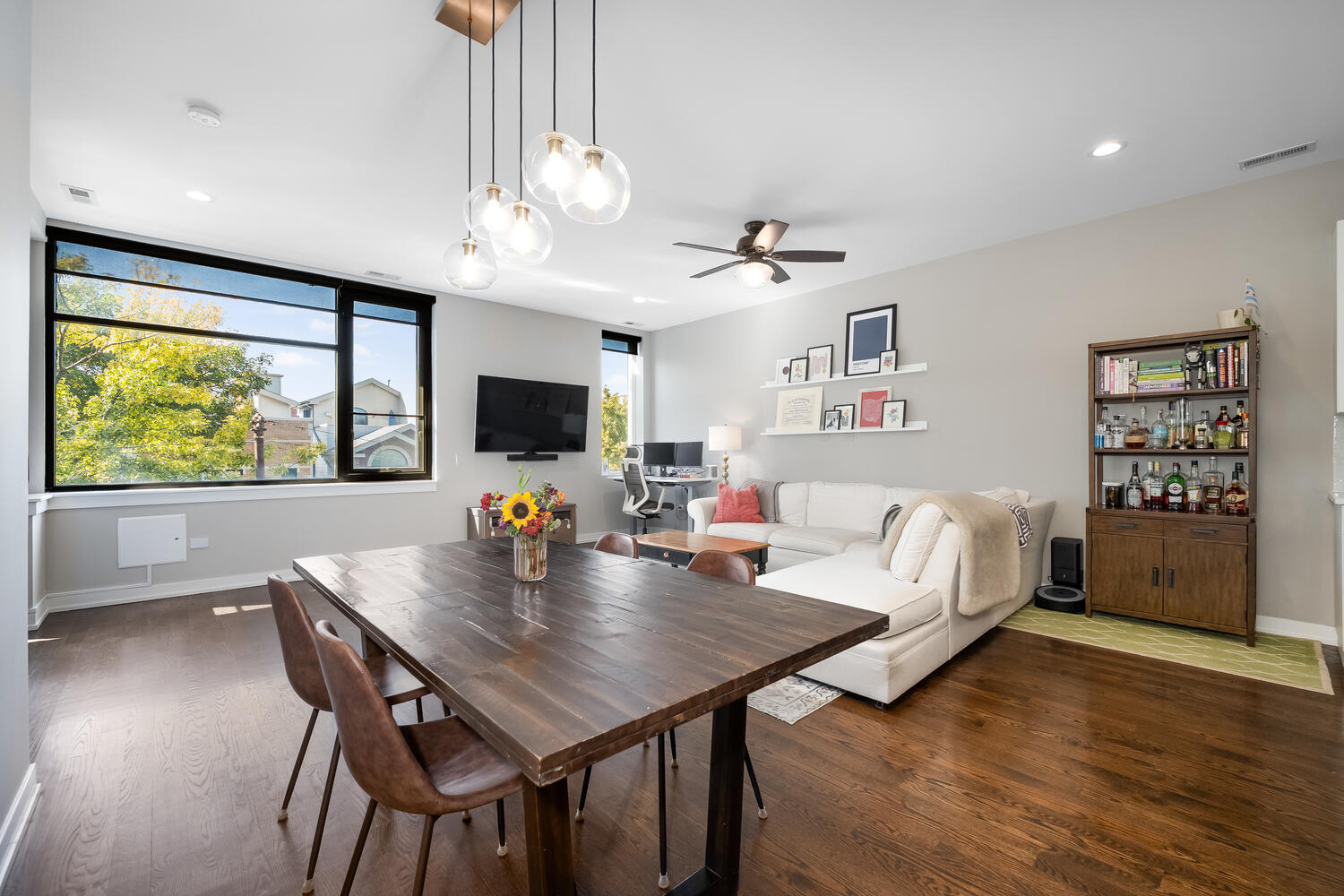 1841 North California Avenue, Unit 3B Chicago, IL 60647 - Photo 8 of 22 a living room with furniture and a large window