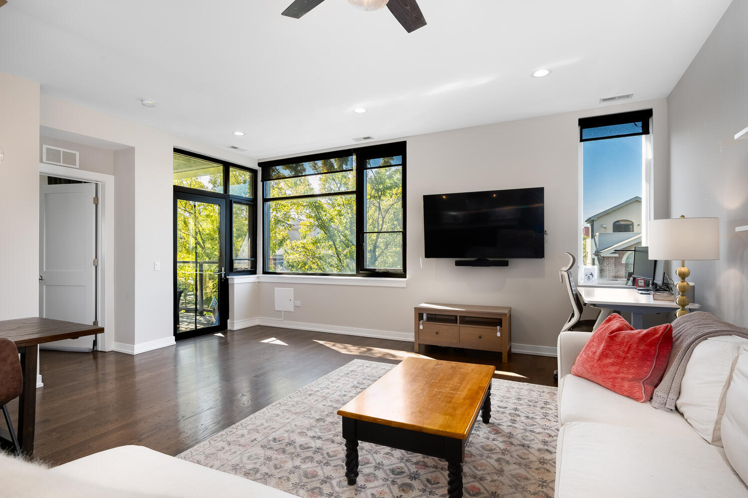 1841 North California Avenue, Unit 3B Chicago, IL 60647 - Photo 9 of 22 a living room with furniture and a flat screen tv