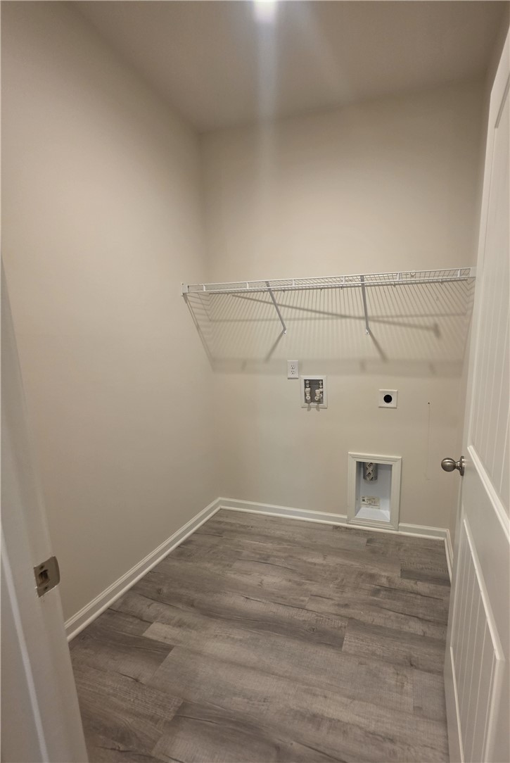 312 Phillips Drive Pendleton, SC 29670 - Photo 18 of 45 This dedicated laundry area offers practical utility connections and convenient overhead shelving.