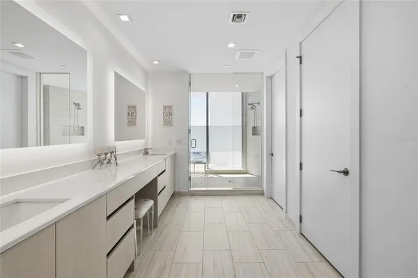 a utility room with sink dryer and washer