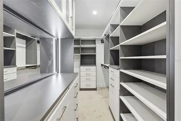 a kitchen with stainless steel appliances granite countertop a sink and a refrigerator