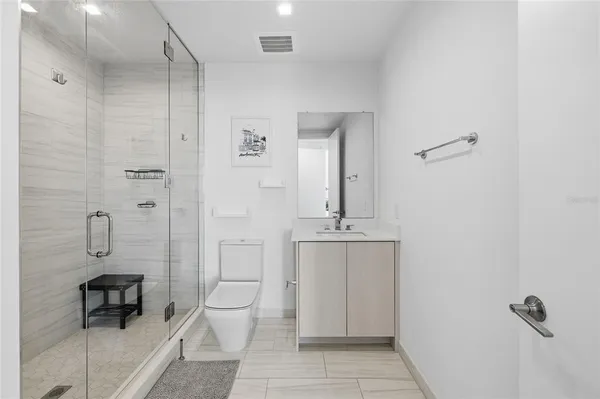 a kitchen with stainless steel appliances granite countertop a white cabinets a stove top oven a sink and dishwasher