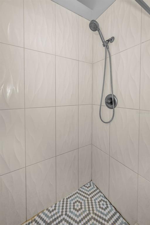 2407 Gun Flint Trail Palm Harbor, FL 34683 - Photo 18 of 43 a bathroom with a shower