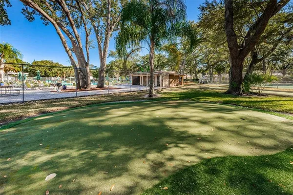 a view of outdoor space with playground and tree