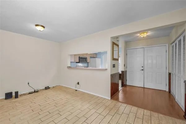 a kitchen with a stove a sink and a microwave