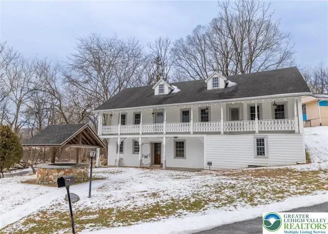 a house that has tree in front of it