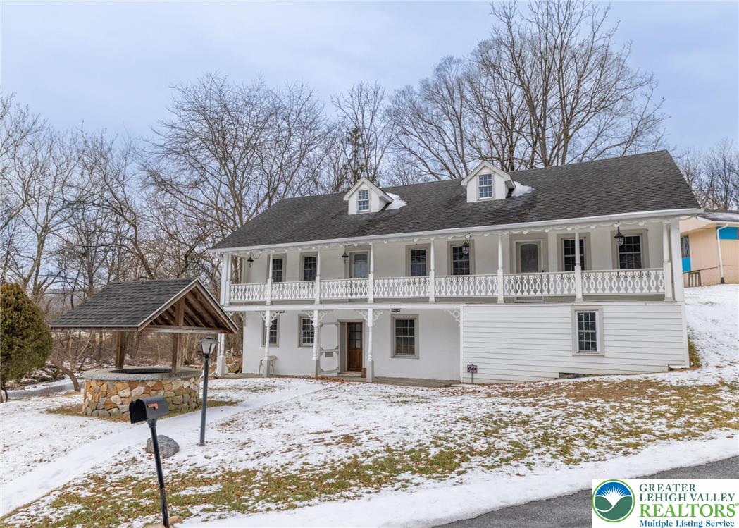 a house that has tree in front of it