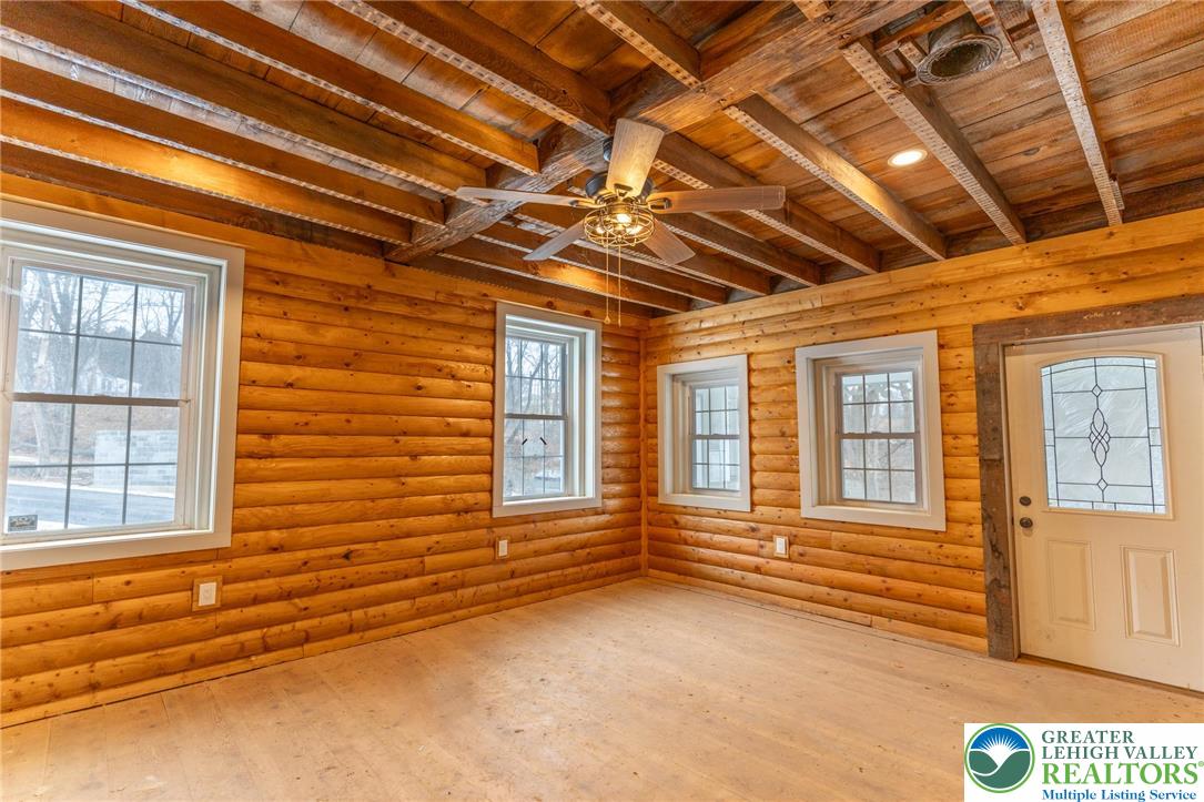 3401 Popular Drive Northampton, PA 18067 - Photo 6 of 21 a view of an empty room with wooden floor and windows
