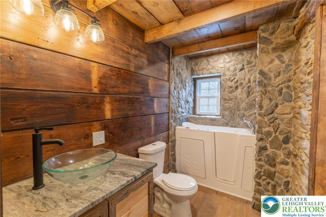 3401 Popular Drive Northampton, PA 18067 - Photo 8 of 21 a bathroom with a granite countertop toilet sink and mirror