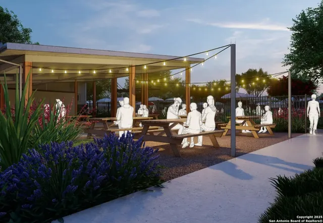 a view of a patio with table and chairs potted plants and floor to ceiling window