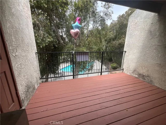 a balcony view with a hardwood