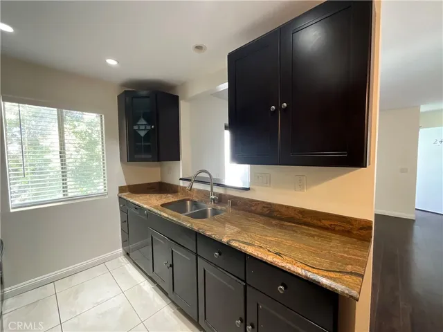 a bathroom with a sink double vanity and a mirror