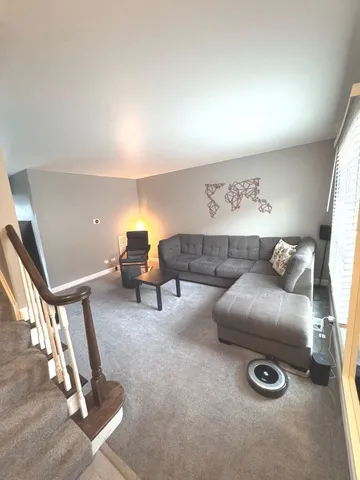 a living room with couch and a view of living room