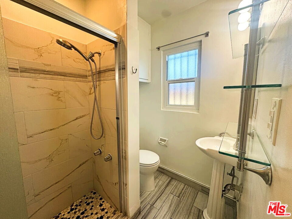 110 South Rampart Boulevard, Unit 3 Los Angeles, CA 90057 - Photo 11 of 17 a bathroom with a shower toilet and sink