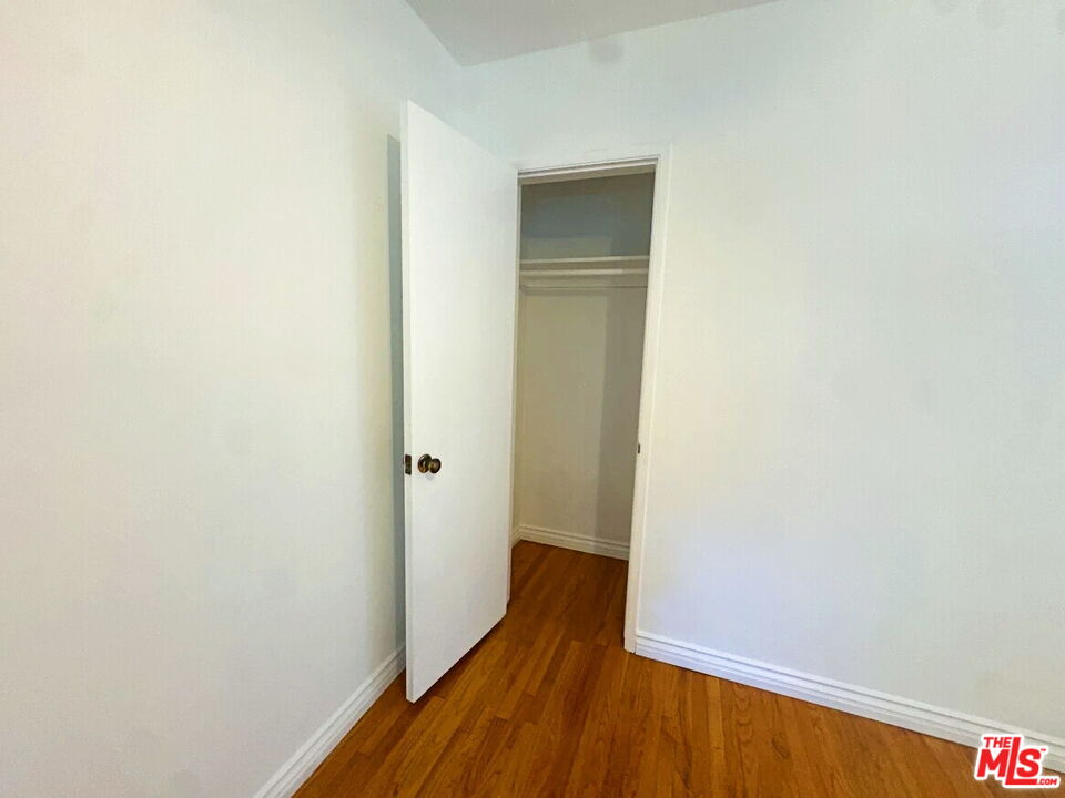 110 South Rampart Boulevard, Unit 3 Los Angeles, CA 90057 - Photo 6 of 17 a view of a room with wooden floor and a hallway