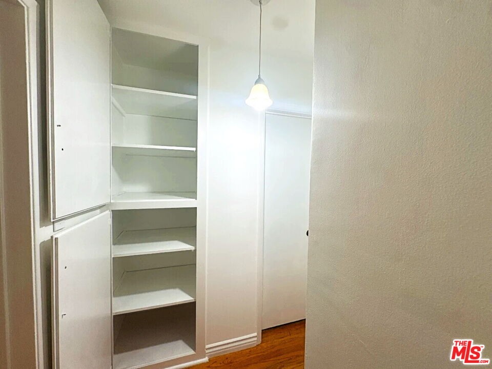 110 South Rampart Boulevard, Unit 3 Los Angeles, CA 90057 - Photo 9 of 17 a view of walk in closet with empty racks