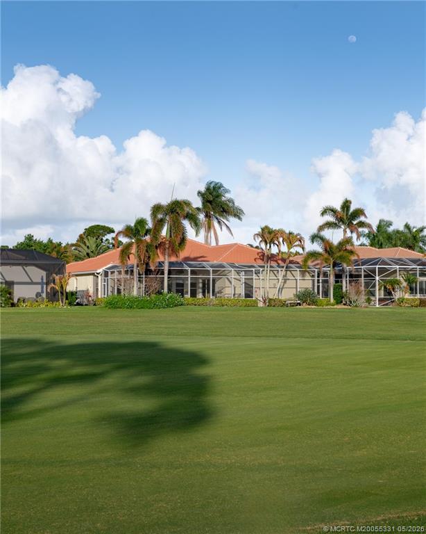 2216 Southeast Stonehaven Road Port St. Lucie, FL 34952 - Photo 38 of 67 a front view of a house with a garden