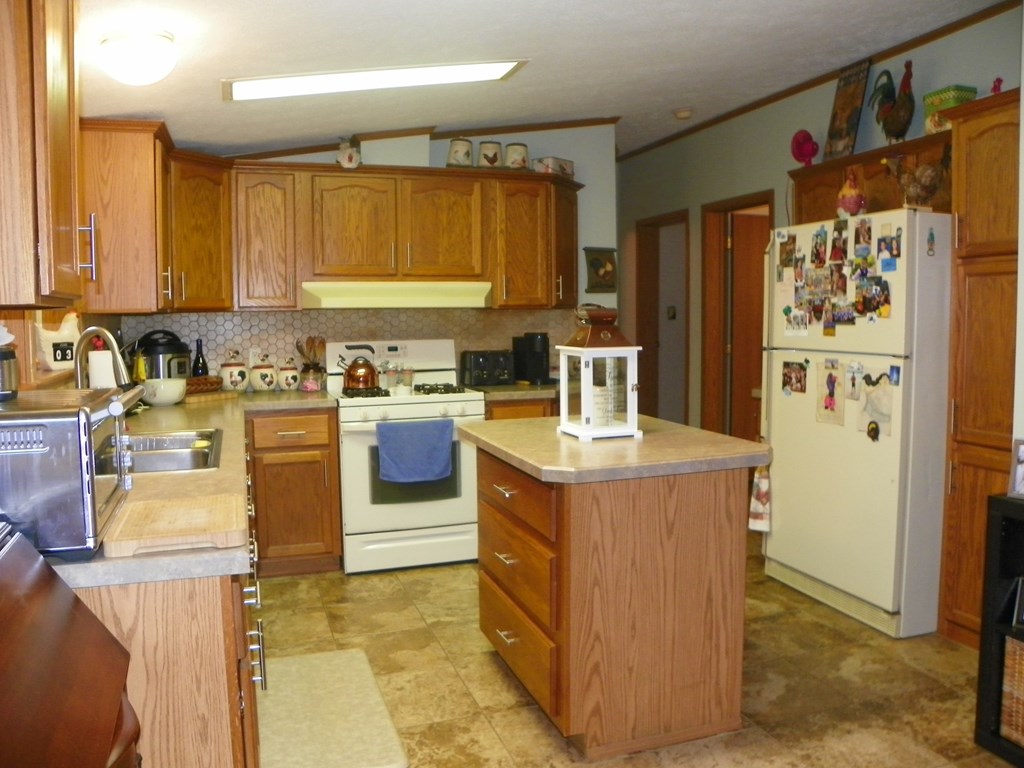 2268 German Hill Road Tionesta, PA 16353 - Photo 11 of 31 a kitchen with a sink stove and refrigerator
