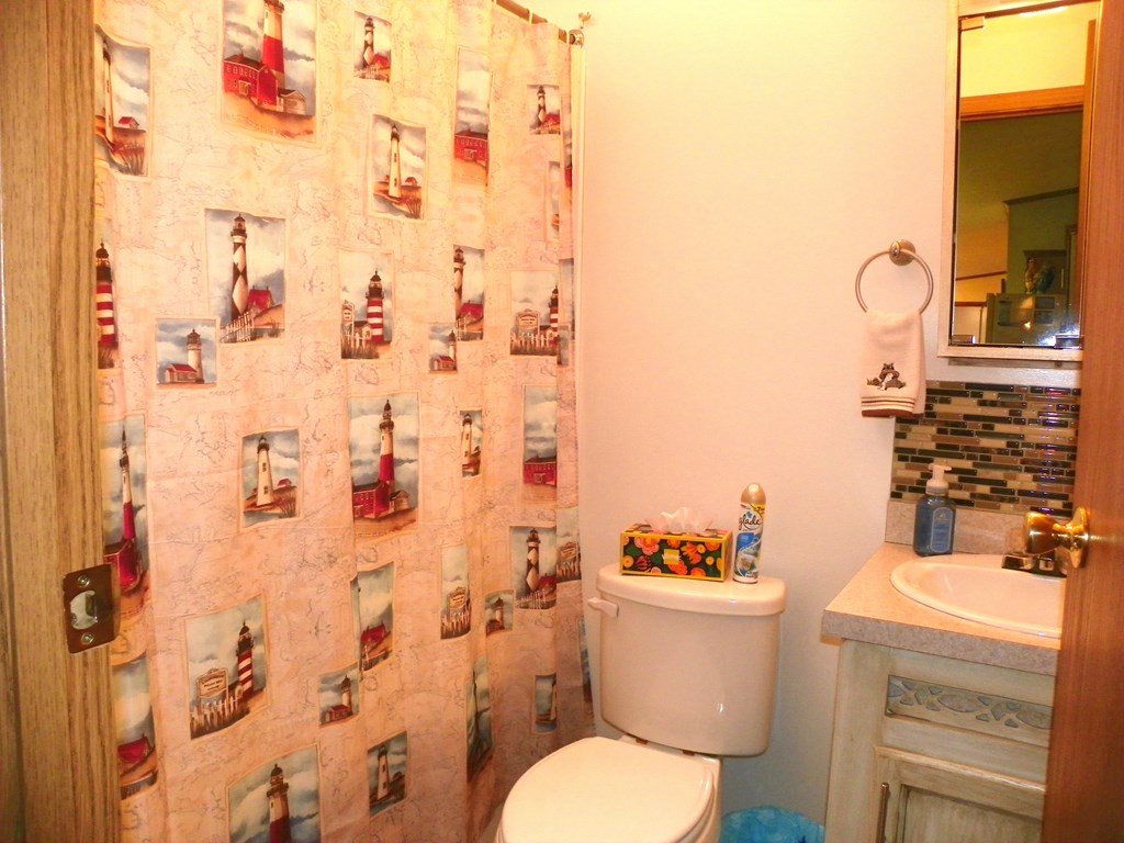 2268 German Hill Road Tionesta, PA 16353 - Photo 24 of 31 a bathroom with a granite countertop toilet sink and mirror