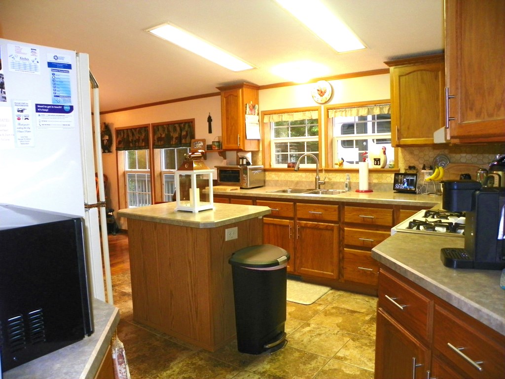2268 German Hill Road Tionesta, PA 16353 - Photo 9 of 31 a kitchen with a sink and wooden cabinets